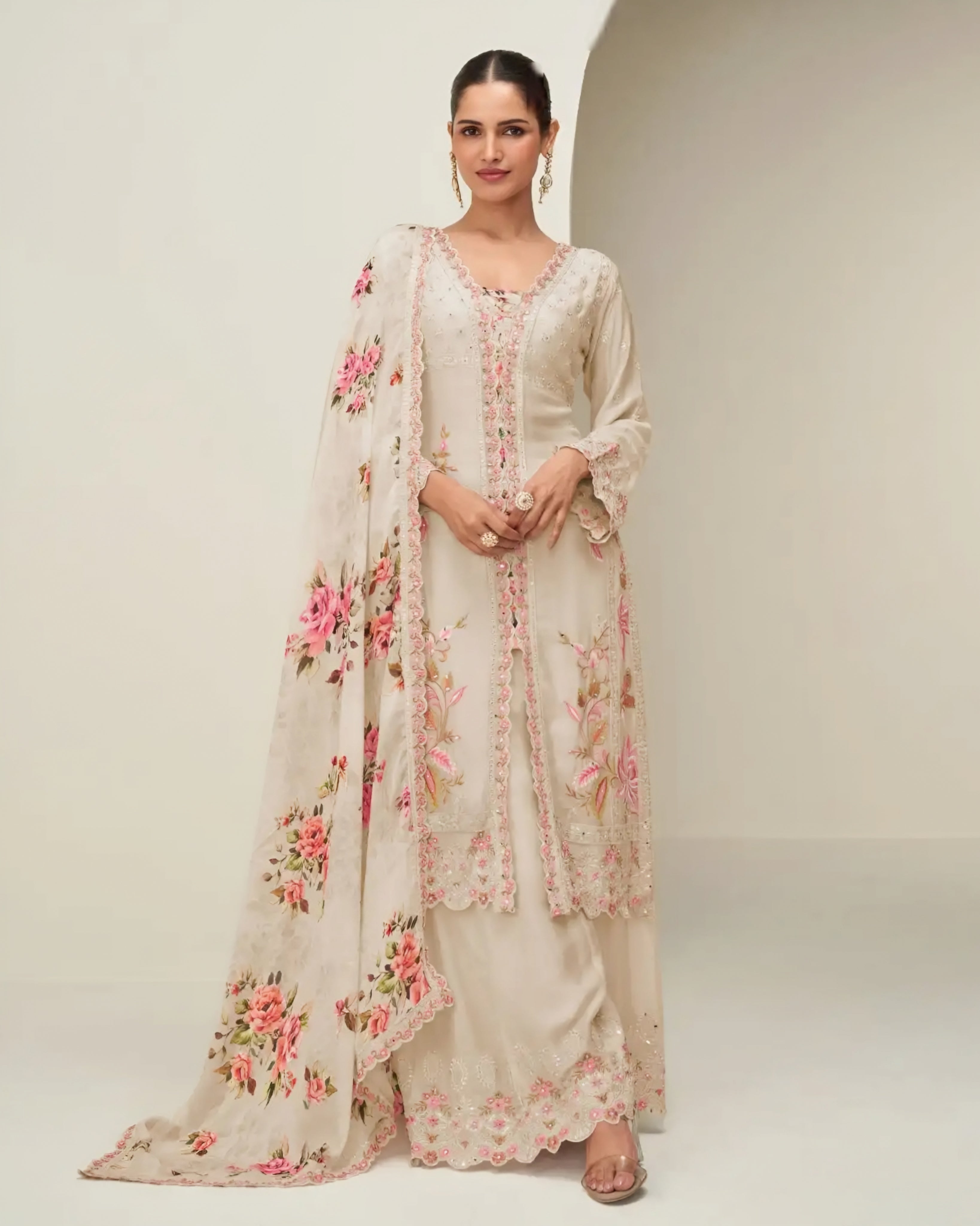 Woman wearing a floral outfit with a white background