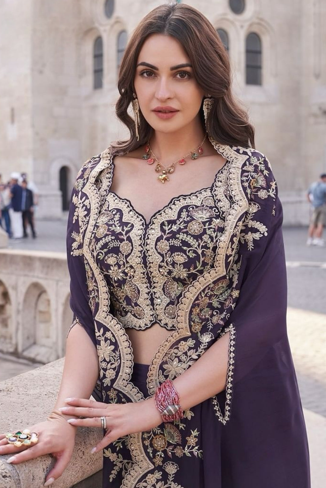 Close-up of the intricate gold embroidery on the deep purple crop top, showcasing fine detailing for weddings and festive occasions
