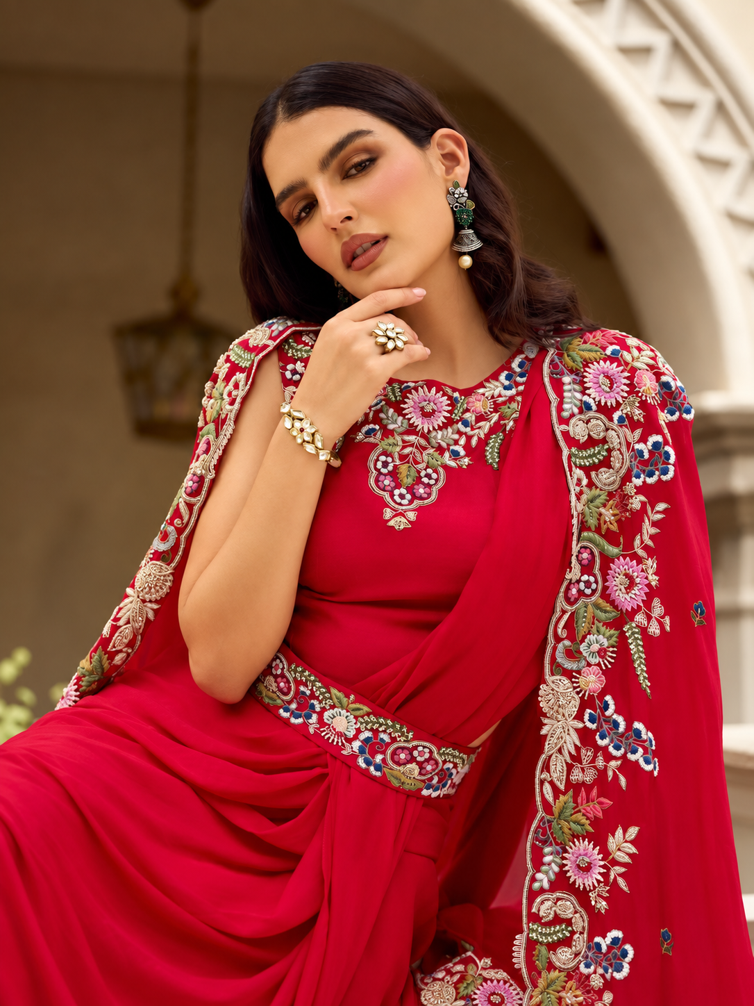 Red embroidered cape-style lehenga set back view