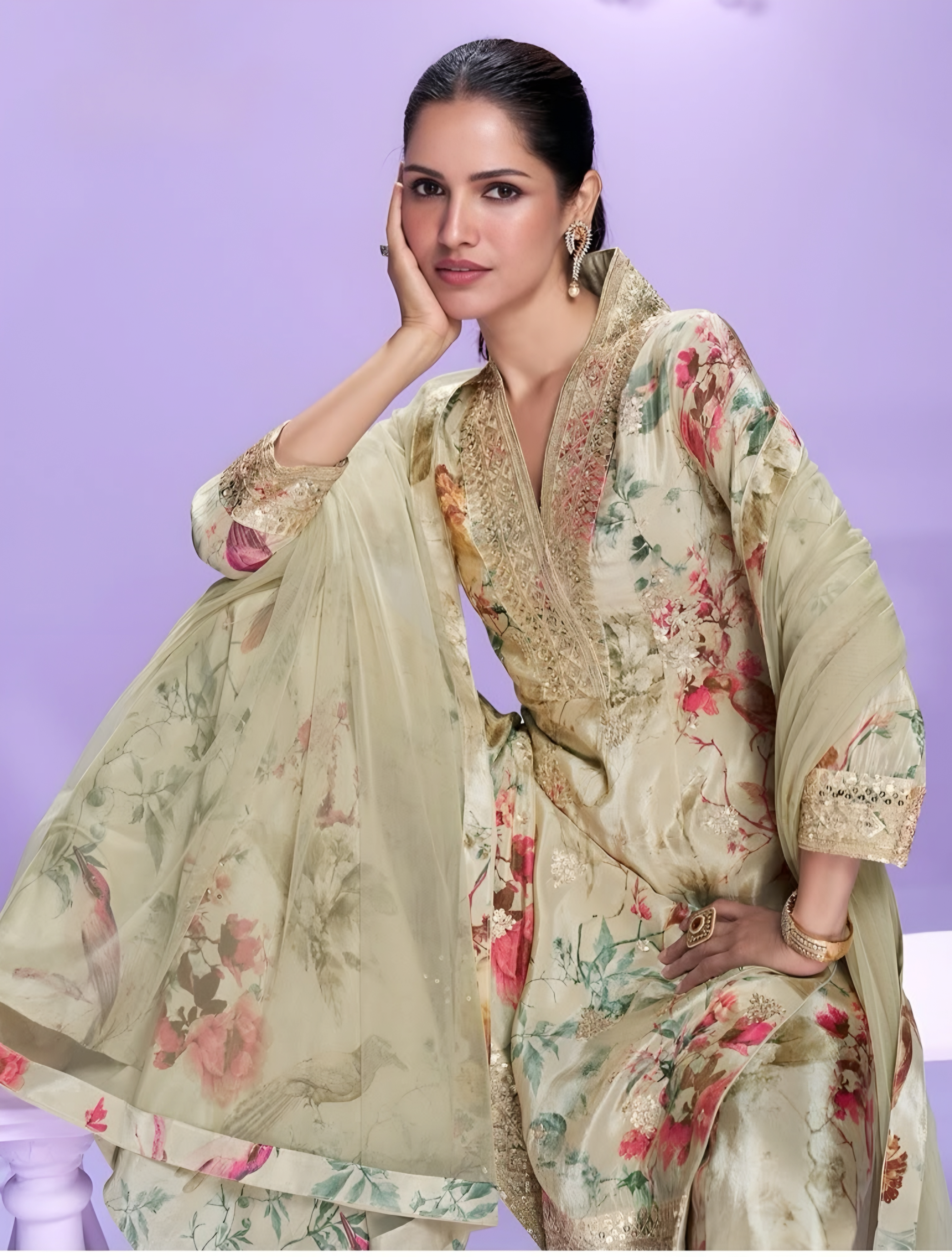 Woman wearing a floral traditional outfit with a light purple background