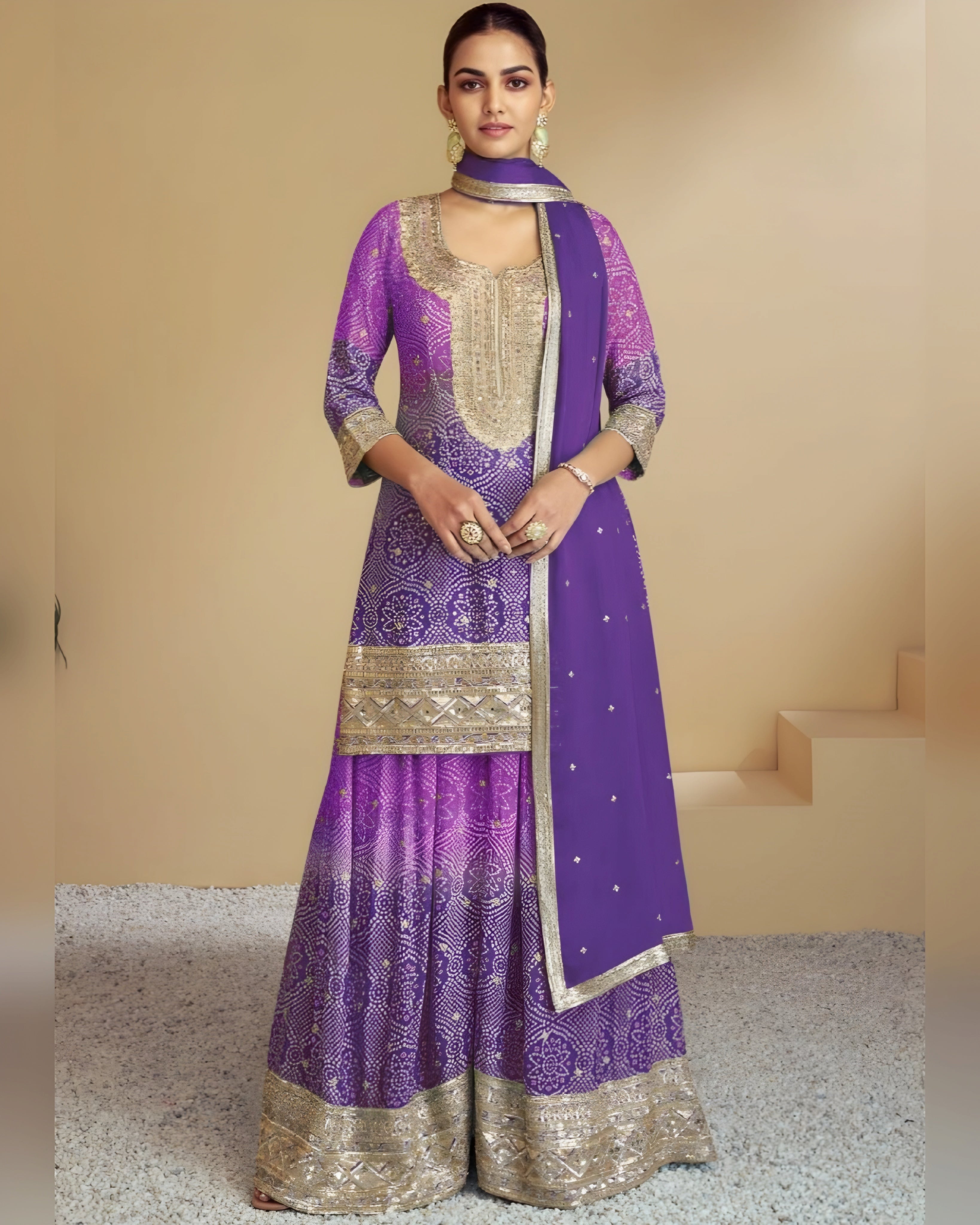 Woman wearing a purple and gold traditional outfit with a plain background