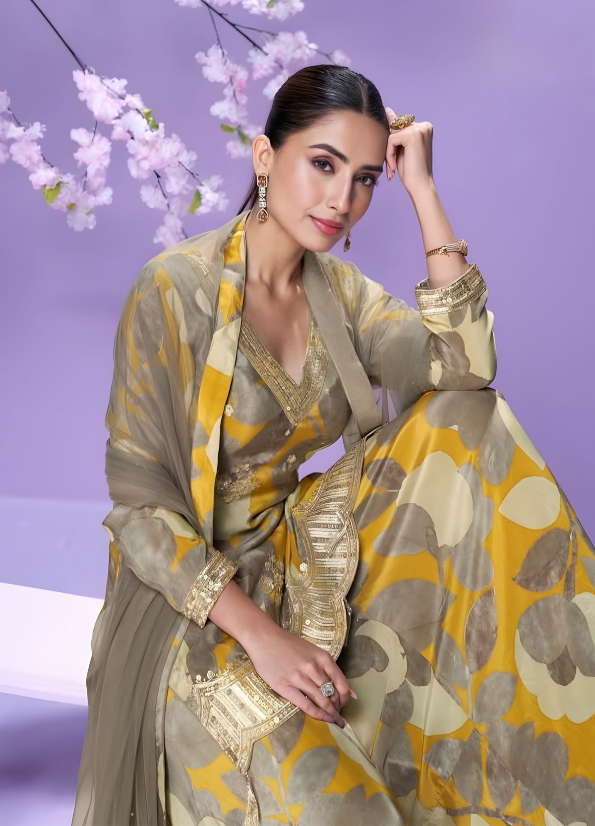 Woman in a floral salwar kameez with Net dupatta