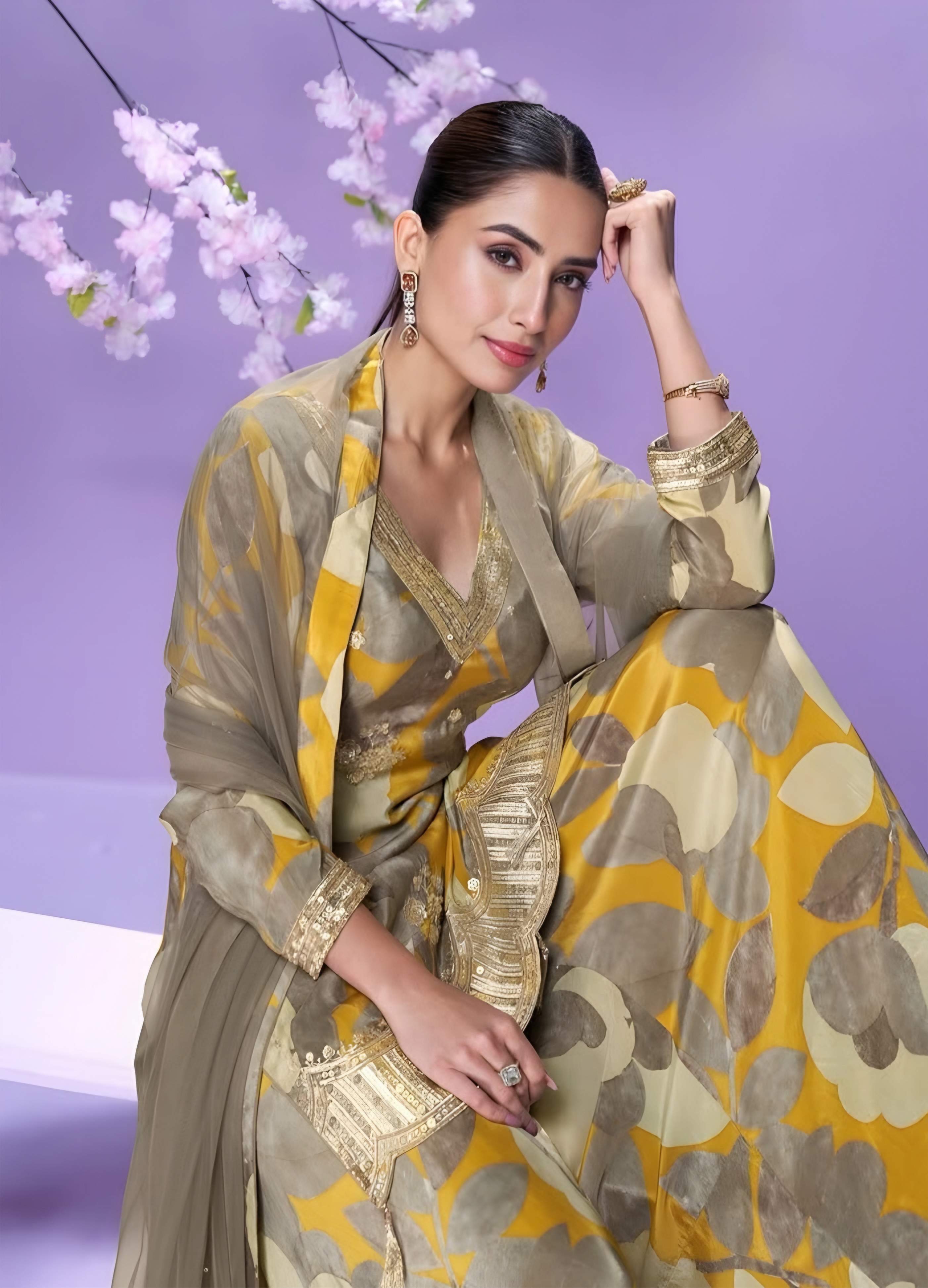 Woman in a floral salwar kameez with Net dupatta